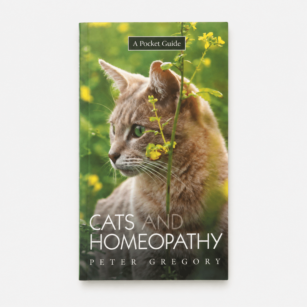 Book cover with orange tabby cat outside in grass and yellow flowers. Title of book reads Cats and Homeopathy: a Pocket Guide. Author is Peter Gregory.